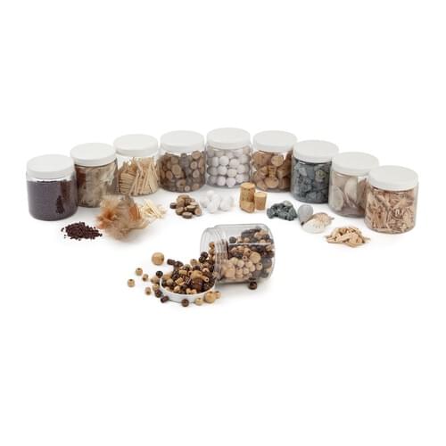 Set of 10 reusable tubs of different natural collage materials. Pack includes 5g feathers, 25g corks, 200 matchsticks, 45g wood chips, 70 spun paper balls, 100g wooden beads, 450g grey gravel, 85g wood slices, 450g brown stones and 125g shells.