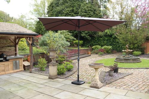 GREY 2.4mx3m Crank and Tilt Rectangular Parasol ,Grey Powder Coated Pole (38mm Pole, 8 Ribs). This parasol is made using Polyester Fabric which has a Weather-Proof Coating & UPF Sun Protection Level 50 | 735338 | 