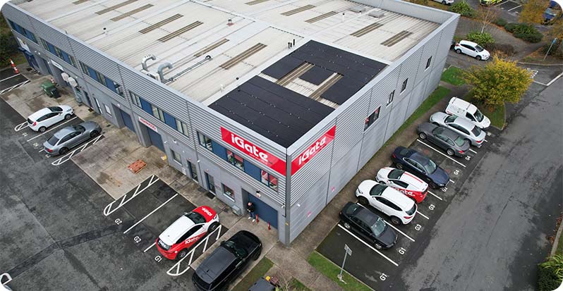 Ariel photo of iGate office premesis with a focus on the roof-mounted solar panels