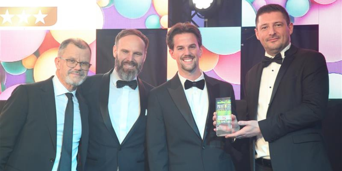 Michael Elphick and Sam Elphick (both centre) receiving the award