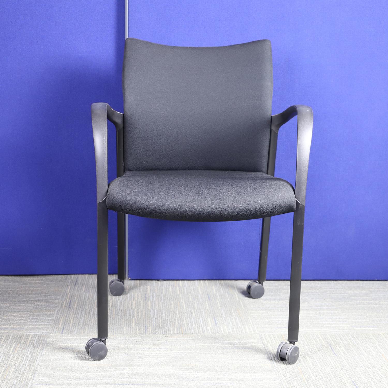 Second Hand Black Meeting Chair with Plastic Back and Black Legs with Casters