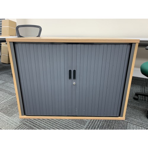 Side Opening Tambour Cupboard, In Limed Oak Finish. 730mm High x 1000mm Width x 600mm Depth. 1 In Stock