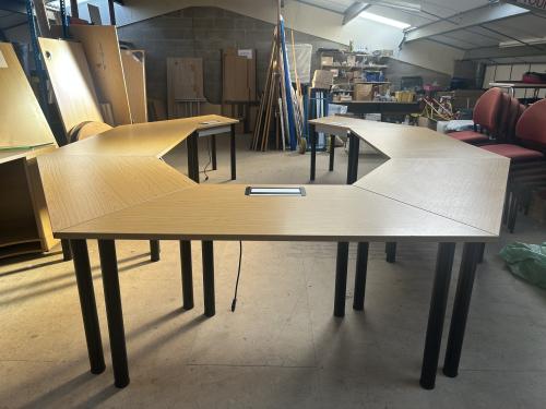 Used Set Of Seven Training Tables (2 x 1600mm Rectangular Tops & 5 x 1600mm Trapezoidal Tops) - Overall Footprint - 4400mm Width x 3200mm Depth - To Seat approx. 14 - In Oak Finish & Black Tubular Legs. 1 Set In Stock