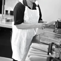 Shield® White Standard Length Disposable Aprons Roll of 200 (Box of 5 Rolls) 1000 aprons