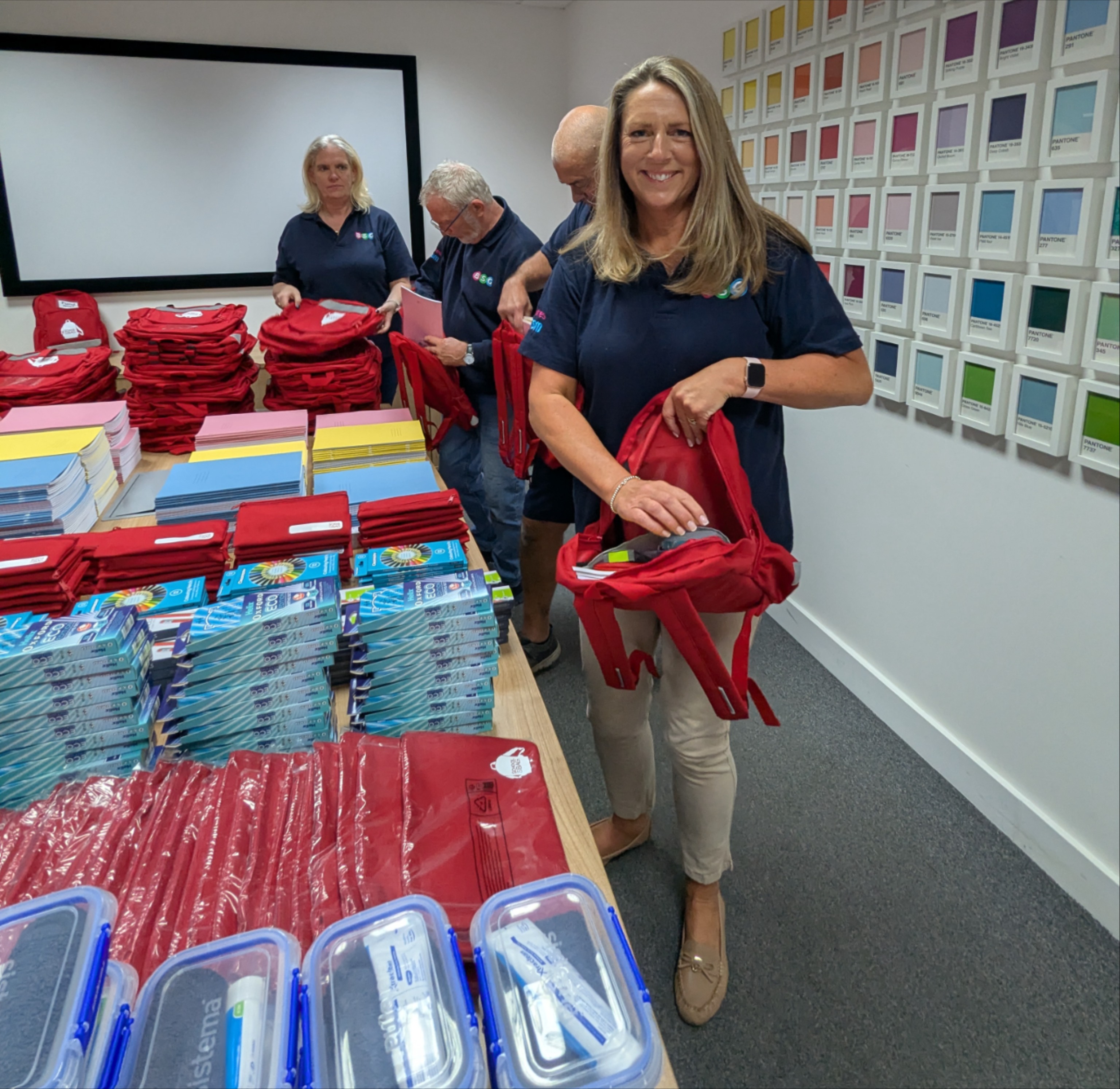 BSG staff member packing School in a Bag rucksack