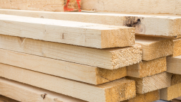 Timber and sheets outside a warehouse