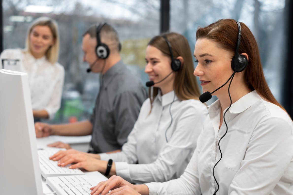 Image of people answering calls in a call centre